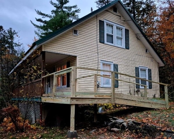 Handicap accessibility ramp — old steep wooden stairs swapped for a safe, gently-sloped entry ramp with solid handrails. Easier, safer access for the whole family, built to last